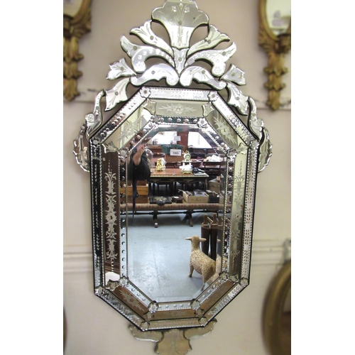 1965 - Reproduction Venetian style octagonal wall mirror, with segmented mirrored border, and shaped surmou... 