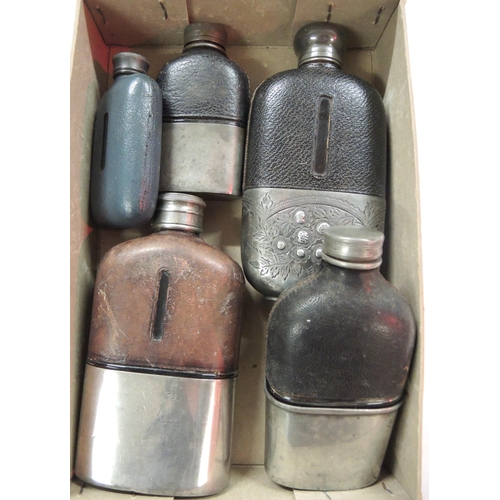 304 - Group of five leather and pewter mounted travelling hip flasks, four with integral beakers