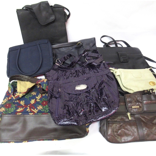 34 - Two bags containing a large collection of various ladies handbags, evening purses etc