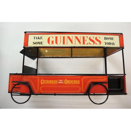 342 - 20th Century Guinness advertising drinks tray in the form of a bus, inscribed ' Guinness Pro Bono Om... 