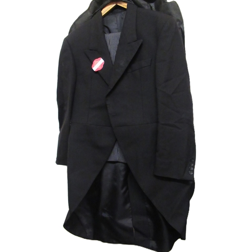 36 - Bag containing various gentleman's suits and jackets, including a mourning suit