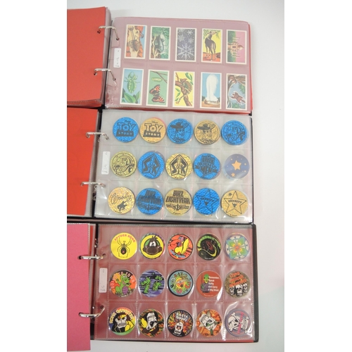 364 - Five albums of trading cards including Merlin Pogs, Goldeneye, Cromwell etc.