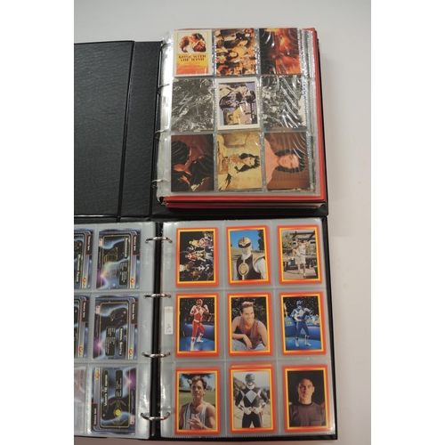 366 - One album of Fleer Overpowered TCG cards, one album of Merlin, Vision and Cornerstone cards, one alb... 