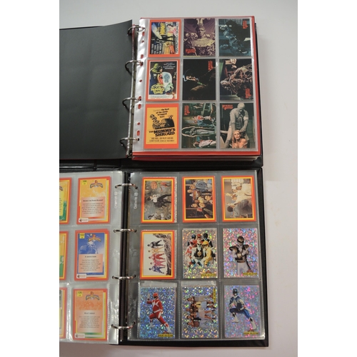 366 - One album of Fleer Overpowered TCG cards, one album of Merlin, Vision and Cornerstone cards, one alb... 