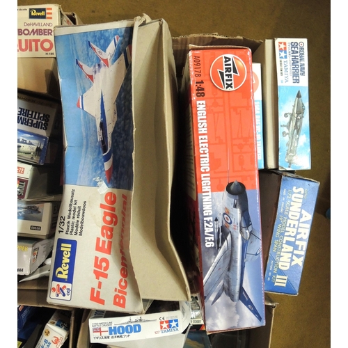 414 - Four boxes containing a quantity of unmade model aircraft kits, including Airfix, Revel, Tamiya, Ita... 