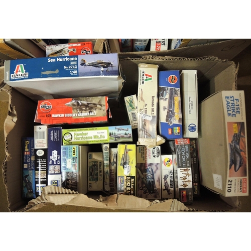 415 - Four boxes containing a quantity of unmade model aircraft kits, including Airfix, Revel, Tamiya, Ita... 