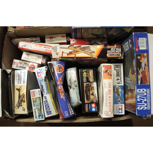 415 - Four boxes containing a quantity of unmade model aircraft kits, including Airfix, Revel, Tamiya, Ita... 