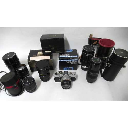 446 - Box containing various cameras and lenses including Olympus OM-1, a Canon and other lenses etc.