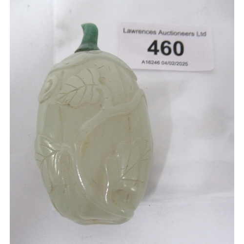 460 - Chinese pale green jade snuff bottle, with floral relief carved decoration and a dark green jade sto... 