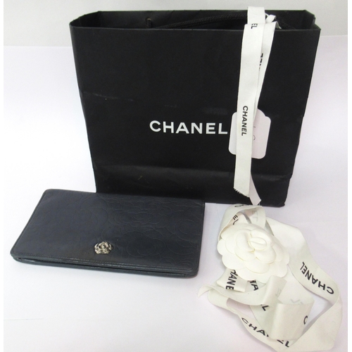 49 - Chanel, Camellia leather bi-fold long wallet, with some Chanel packaging