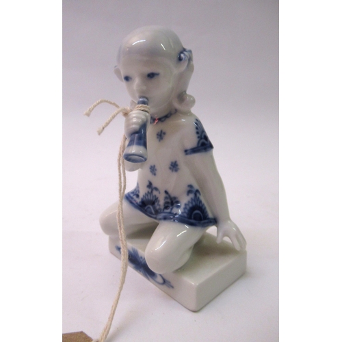 595 - Royal Copenhagen porcelain figure of a kneeling girl playing a horn, No. 4796, 10cm high