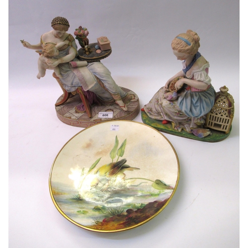 606 - Late 19th Century French bisque polychrome figure of a seated girl feeding a bird, 24cm high, togeth... 