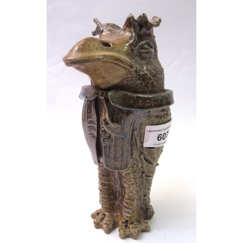 607 - Jennie Hale, salt glazed stoneware jar and cover modelled as a grotesque bird wearing a suit, 20cm h... 