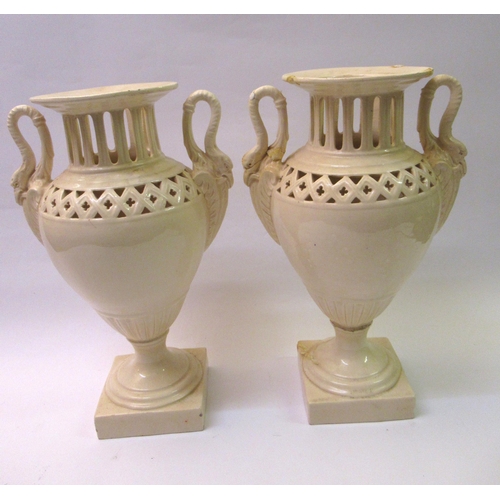 711 - Bretby two handled jardiniere, 31cms tall, together with a pair of creamware style two handled vases... 