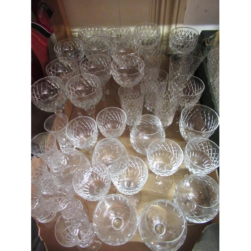 719 - An extensive suite of modern cut glass drinking glasses comprising:  eleven red wine, eight white wi... 