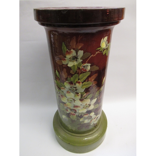 738 - Bretby, green glazed pottery jardiniere on a floral decorated stand