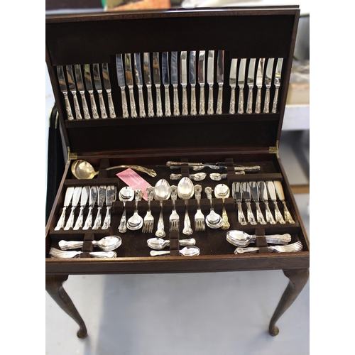 760 - Canteen of Kings pattern silver plated cutlery in a reproduction cabinet with leather inset top