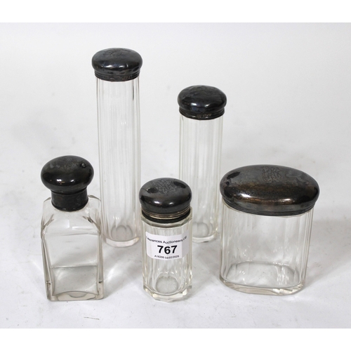 767 - Group of five silver mounted and cut glass dressing table bottles