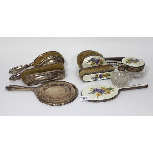 770 - London silver and enamel floral hand painted seven piece dressing table set, and another silver back... 