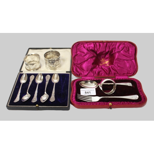 841 - Cased silver Christening set, two silver napkin rings and five Edwardian silver spoons (boxed)