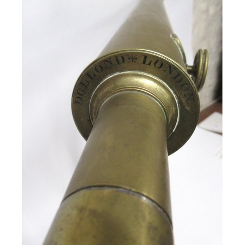 87 - Dolland of London, 2.5in brass refracting telescope on tripod base