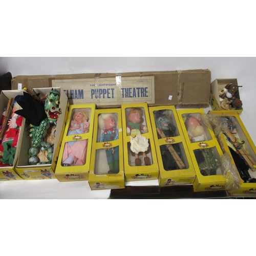 89 - Nine various Pelham puppets in original boxes, together with a Pelham puppet theatre