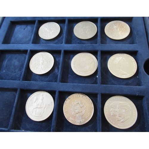 911 - Two cases containing a collection of various collectable fifty pence pieces, five pound coins and tw... 