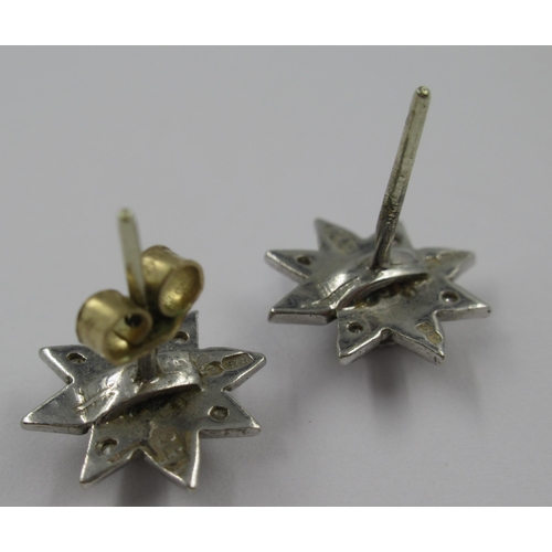 944 - Pair of 9ct white gold diamond set star cluster stud earrings