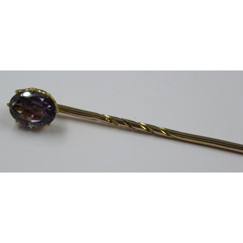 998 - 19th Century gold stick pin, mounted with an oval mauve sapphire