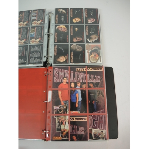 386 - One album of Inkworks Smallville trading cards including various autographs, an album of Battlestar ... 