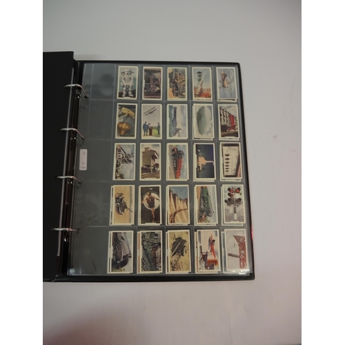 396 - One large album of Godfrey Phillips cigarette cards