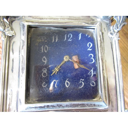 762 - Early 20th Century silver cased dressing table clock with enamel dial and keywind movement, 13cm hig... 