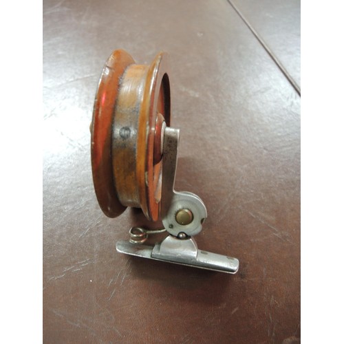 127 - French Decantelle 4in fishing reel, together with a wooden ' The Brownie ' 3.5in fishing reel and a ... 