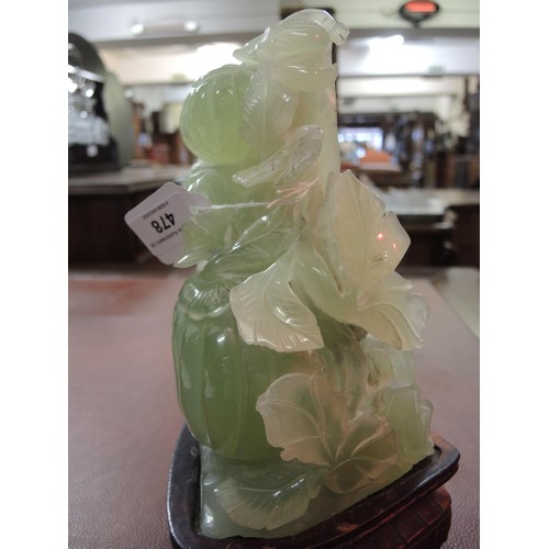 478 - Large 20th Century Chinese jadeite carving on a hardwood stand, 25cm high