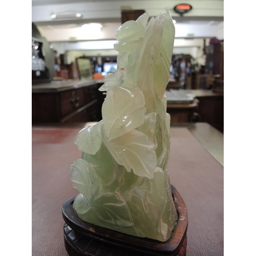 478 - Large 20th Century Chinese jadeite carving on a hardwood stand, 25cm high