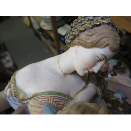 606 - Late 19th Century French bisque polychrome figure of a seated girl feeding a bird, 24cm high, togeth... 