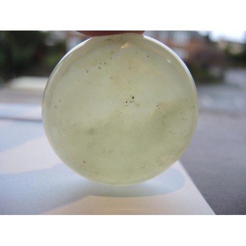 465 - Small circular pale green jade box and cover, 52mm diameter