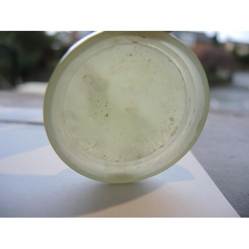 465 - Small circular pale green jade box and cover, 52mm diameter