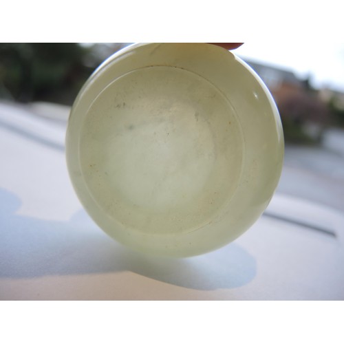 465 - Small circular pale green jade box and cover, 52mm diameter