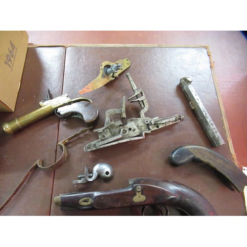 267 - Large quantity of antique and later flintlock and percussion, pistol and rifle spares, including sto... 