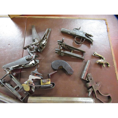 267 - Large quantity of antique and later flintlock and percussion, pistol and rifle spares, including sto... 