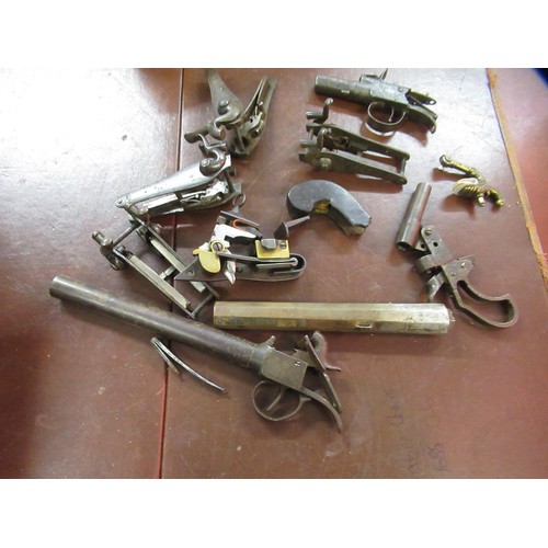 267 - Large quantity of antique and later flintlock and percussion, pistol and rifle spares, including sto... 