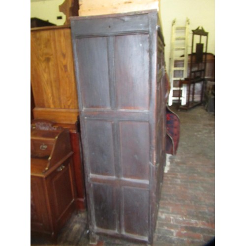 1974 - Oak two door cupboard, constructed from 17th Century panelling, with carved decoration, stile end su... 