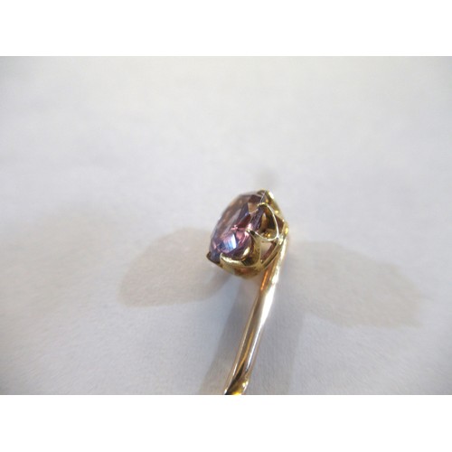 998 - 19th Century gold stick pin, mounted with an oval mauve sapphire