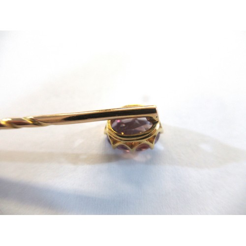 998 - 19th Century gold stick pin, mounted with an oval mauve sapphire