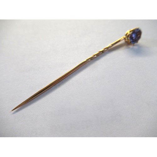 998 - 19th Century gold stick pin, mounted with an oval mauve sapphire