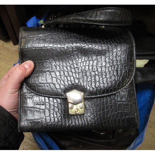 34 - Two bags containing a large collection of various ladies handbags, evening purses etc