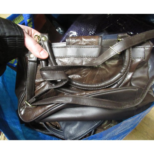 34 - Two bags containing a large collection of various ladies handbags, evening purses etc