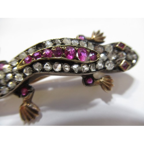 1001 - Unmarked yellow and white metal lizard brooch set rose cut diamonds and pink rubies, 5.5cm long, 6.5... 