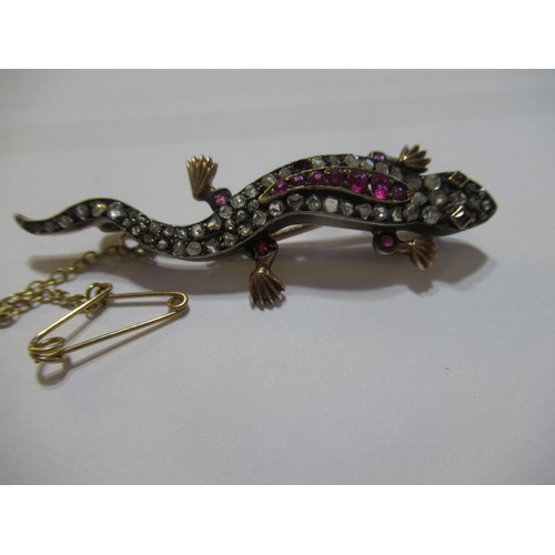 1001 - Unmarked yellow and white metal lizard brooch set rose cut diamonds and pink rubies, 5.5cm long, 6.5... 